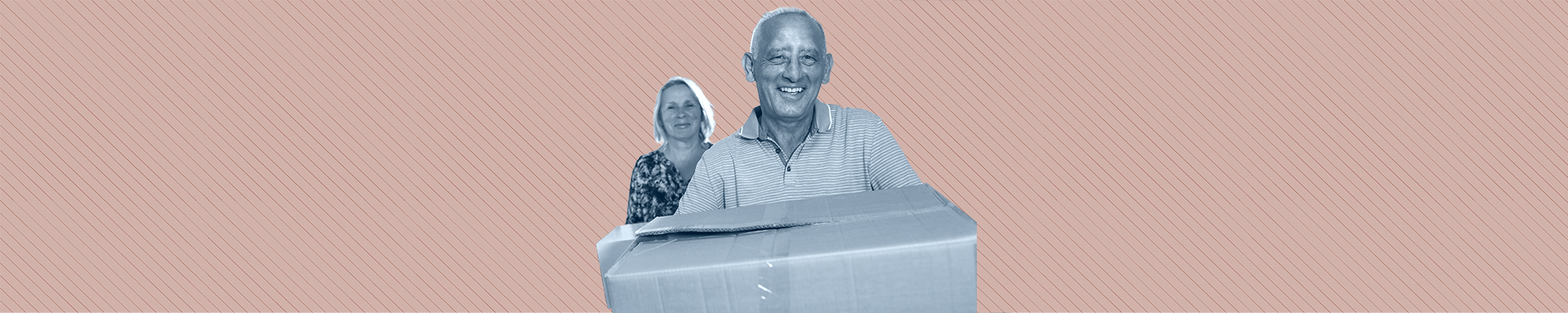 An elder couple move boxes into their new home.